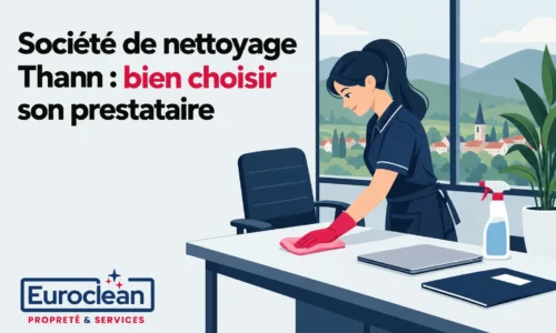 Une agente de nettoyage porte des gants rouges et nettoie une table dans un bureau lumineux.